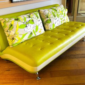 Two  tone  vinyl  two  and  a  half  seater   sofa  with  curved  features  on  chrome  legs,  one  replacement  rear  leg. European  (probably  Italian) circa  1970