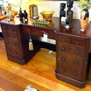 Colonial cedar twin pedestal desk, with central drawer and faux drawers (doors) which open to reveal internal drawers, on concealed castors Australia circa 1880