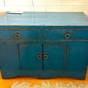 Lacquered elm provincial cabinet with two drawers above two doors on a stepped base China circa 1920